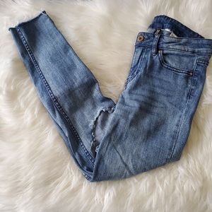 Divided distressed raw hem crop medium wash jean